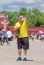 Man takes selfie on sunny Tiananmen Square, Beijing, China
